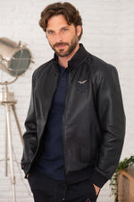 Perforated lambskin jacket in navy, stand-up collar, snap pockets. - Image n°1