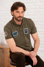 Olive green cotton polo shirt with distressed patches - Image n°1