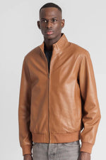 Sleek cognac-colored leather jacket with high collar - Image n°1