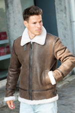 Aged brown shearling jacket-classic aviator warmth and vintage appeal. - Image n°1