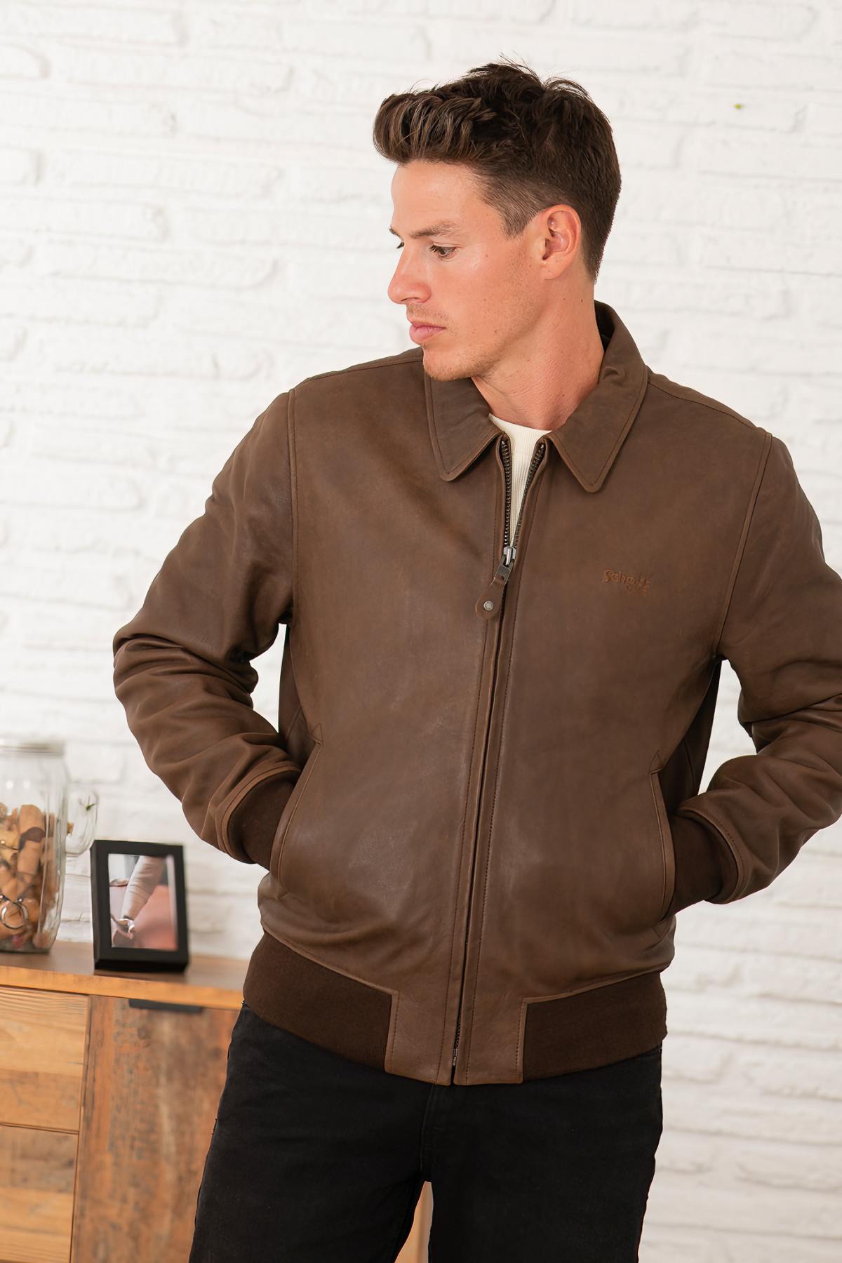 Vintage brown leather jacket with shirt collar and ribbed edges at waist and cuffs - Image n°1