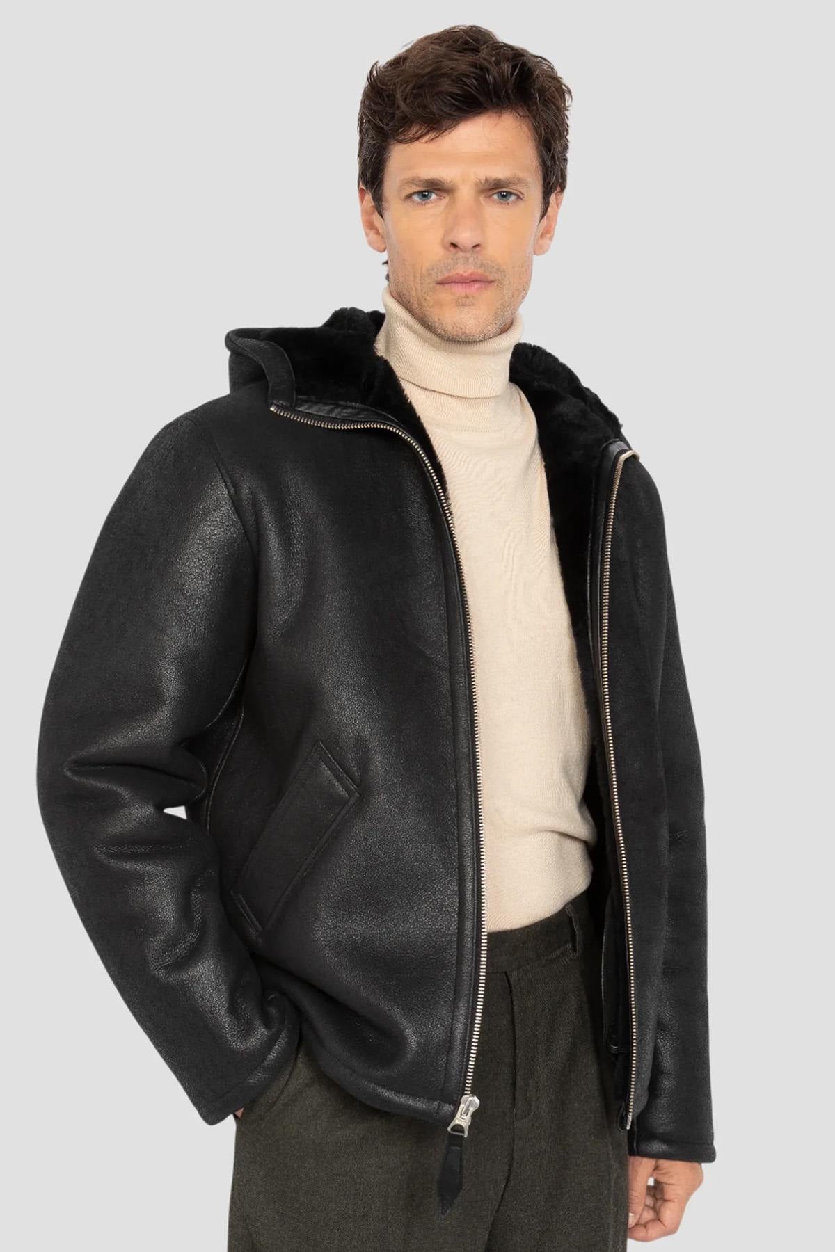 Warm reversed sheepskin bomber by Schott in matte black with a hood. - Image n°1