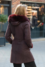 Luxurious wine red shearling jacket, fox fur hood, rashed lamb warmth. - Image n°4