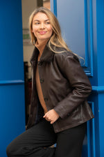 Lambskin in deep brown, removable fur collar, tailored and versatile. - Image n°1