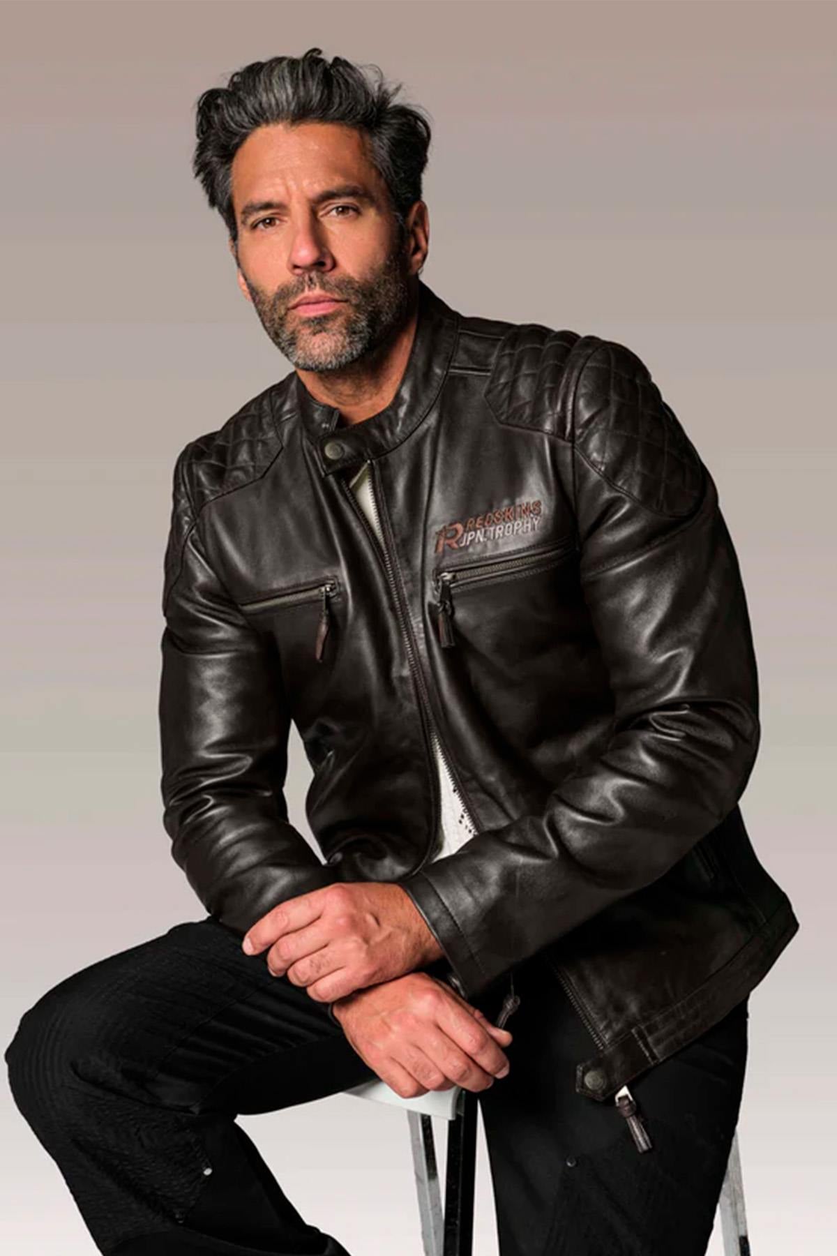 Black leather jacket with quilted shoulders and biker collar - Image n°1