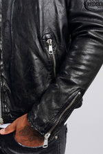 Black leather biker jacket with tone-on-tone patches and embroidery - Image n°5