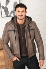 Serge Pariente's taupe lambskin jacket with a removable jersey hood. - Image n°1