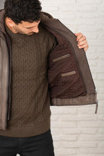 Serge Pariente's taupe lambskin jacket with a removable jersey hood. - Image n°6