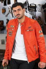 Bold orange lambskin moto jacket with quilted shoulders and patches. - Image n°2