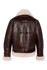 Vintage warmth meets Schott's B-3 bomber in cracked brown shearling. - Image n°6