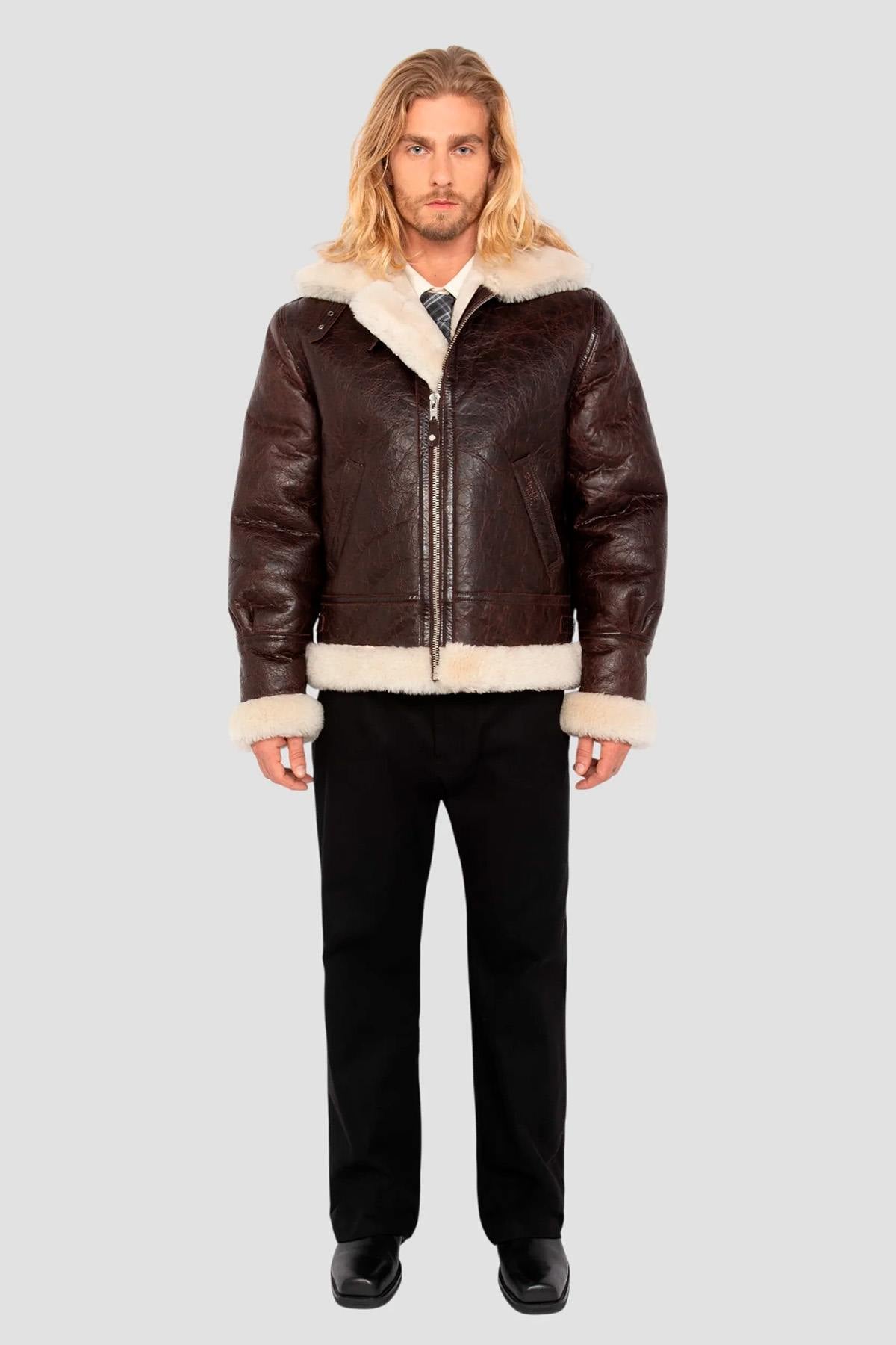 Vintage warmth meets Schott's B-3 bomber in cracked brown shearling. - Image n°7