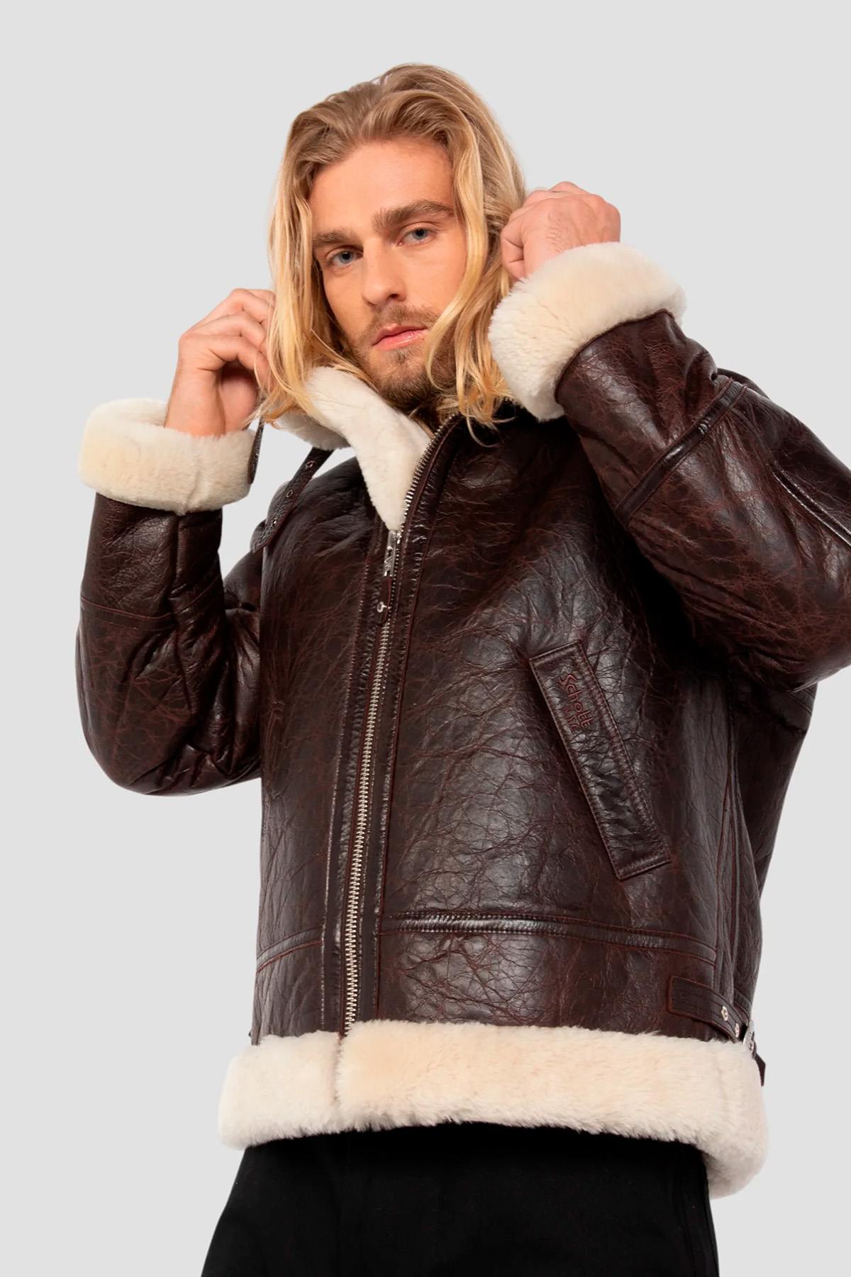Vintage warmth meets Schott's B-3 bomber in cracked brown shearling. - Image n°1
