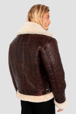 Vintage warmth meets Schott's B-3 bomber in cracked brown shearling. - Image n°2