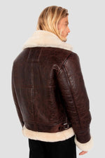 Vintage warmth meets Schott's B-3 bomber in cracked brown shearling. - Image n°2
