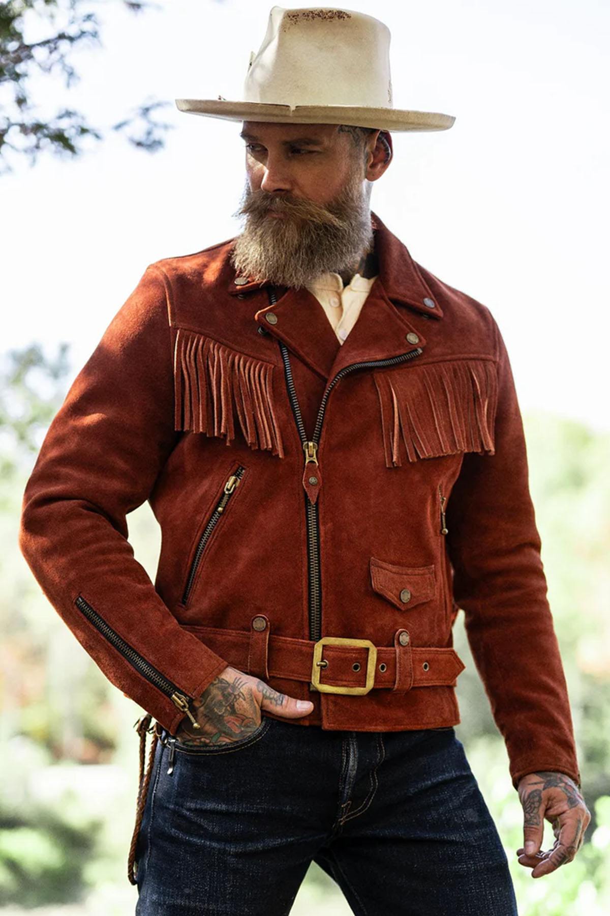 Copper roughout cowhide, fringes and brass for a Western-inspired edge. Rugged yet refined. - Image n°1