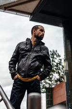 Black and cognac lambskin jacket with removable hood and biker edge. - Image n°6