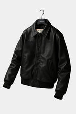 Black cowhide jacket with 3D embroidery and a structured teddy cut. - Image n°9