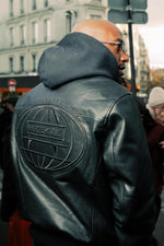 Black cowhide jacket with 3D embroidery and a structured teddy cut. - Image n°8