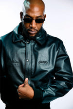 Black cowhide jacket with 3D embroidery and a structured teddy cut. - Image n°5