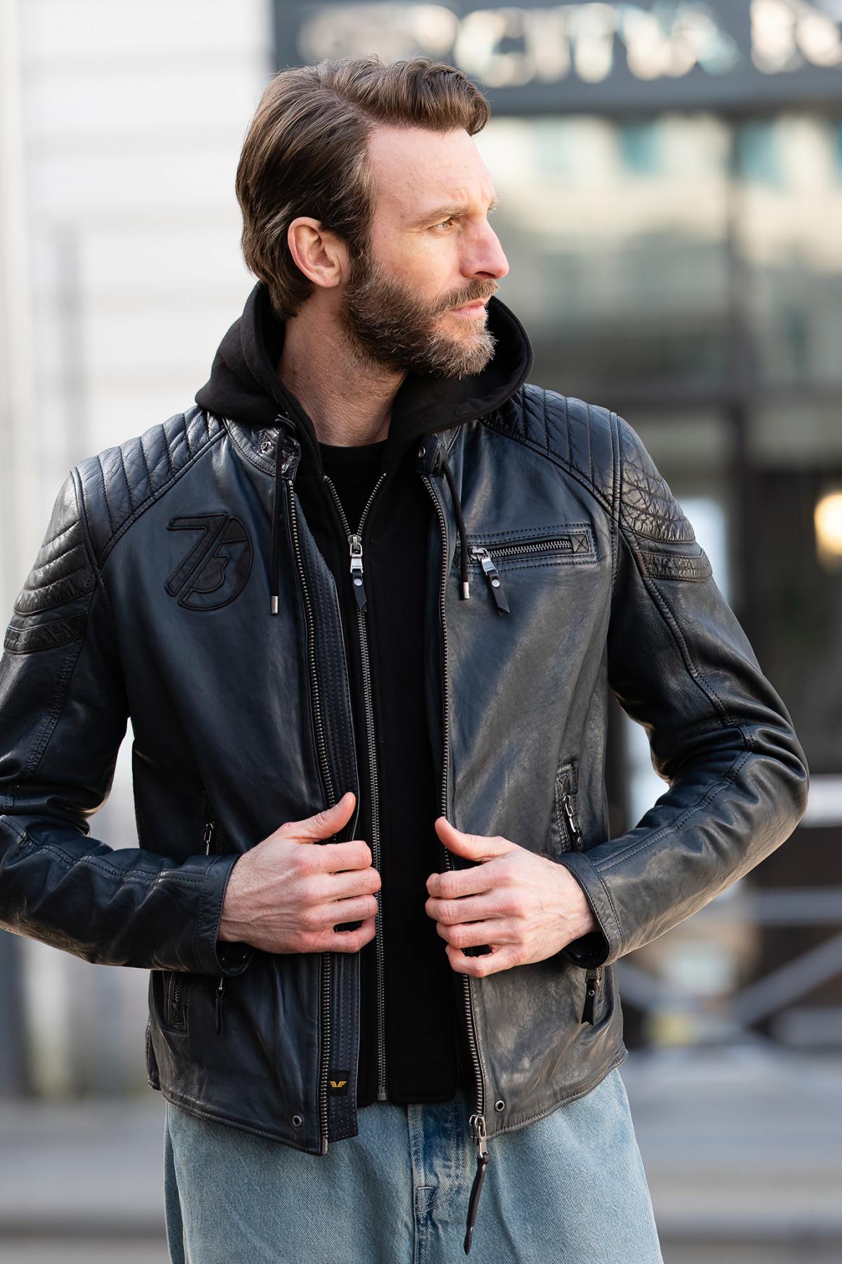 Navy blue and black biker-collar leather jacket with removable hood - Image n°1