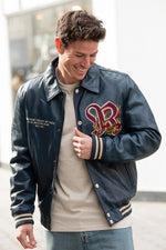 Navy blue leather teddy jacket with shirt collar and embroidery - Image n°1