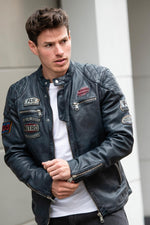 Bold lambskin jacket in ocean blue. Slim fit with six racing badges. - Image n°1