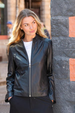 Women's black leather openwork jacket with round neck - Image n°1