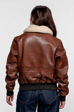 Warm, tailored lambskin aviator in dark cognac with fur collar. - Image n°10