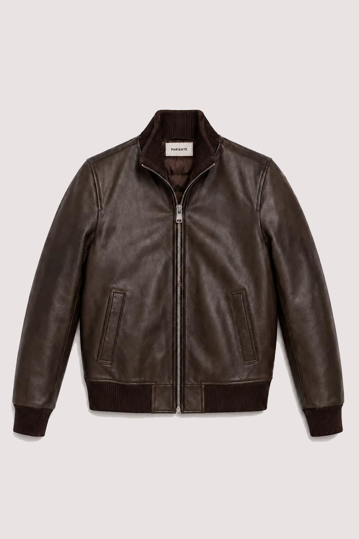 Brown leather varsity jacket with a quilted, puffer-style lining. - Image n°1