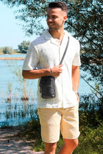 Black leather bag with embossed logo - Image n°6