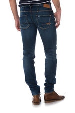 Raw blue jeans faded and with holes - Image n°2