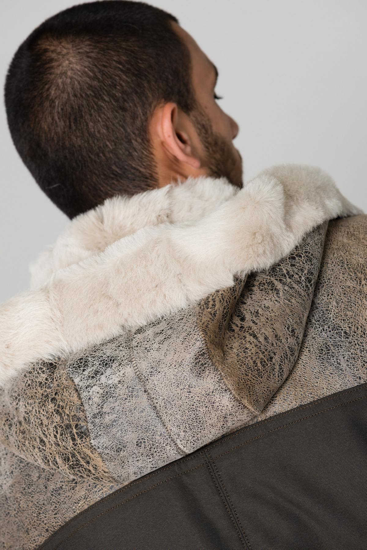 Sheepskin and textile parka - Image n°10