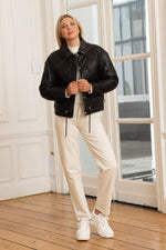 Quilted black sheepskin jacket, zip-fastened with a high neck. - Image n°2