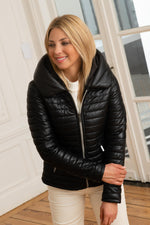 Quilted lambskin jacket in deep black, white zip and statement collar. - Image n°1