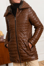 Tailored cognac lambskin puffer, mid-thigh for sleek winter warmth. - Image n°1