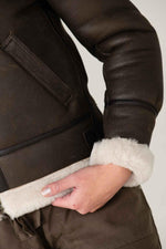 Dark brown sheepskin bomber by Schott. Warm, textured, slim-fit. - Image n°8