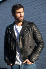 Black lambskin biker jacket with quilted shoulders and asymmetric zip. - Image n°1
