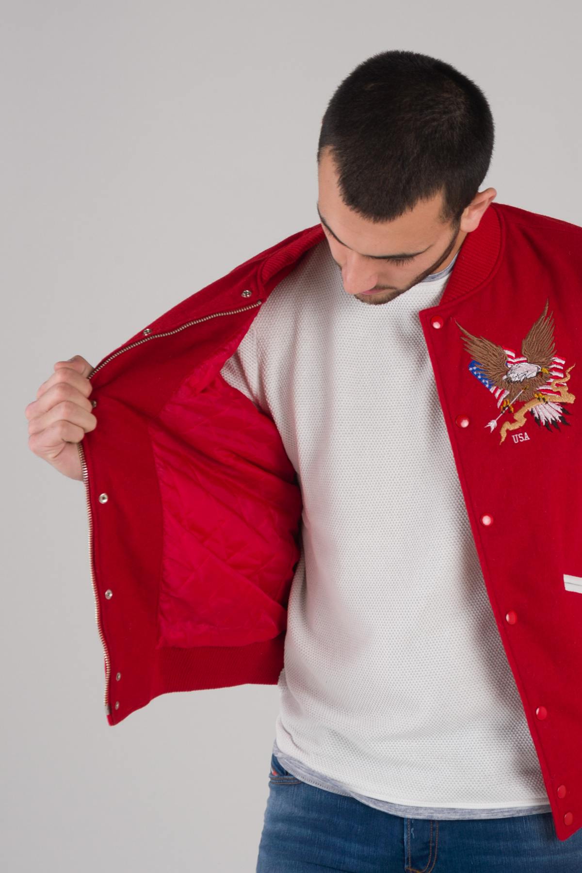 Red and white varsity jacket with quilted lining and contrast details. - Image n°10