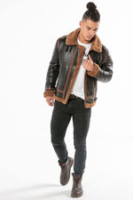 Oiled black sheepskin bomber with cognac shearling lining. - Image n°7