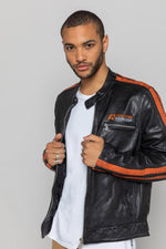 Black lambskin biker jacket with bold orange accents. Slim and sharp. - Image n°1