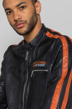 Black lambskin biker jacket with bold orange accents. Slim and sharp. - Image n°2
