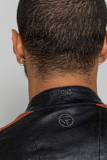 Black lambskin biker jacket with bold orange accents. Slim and sharp. - Image n°6