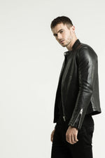 Black lambskin jacket with a semi-matte finish and silver zips. - Image n°12