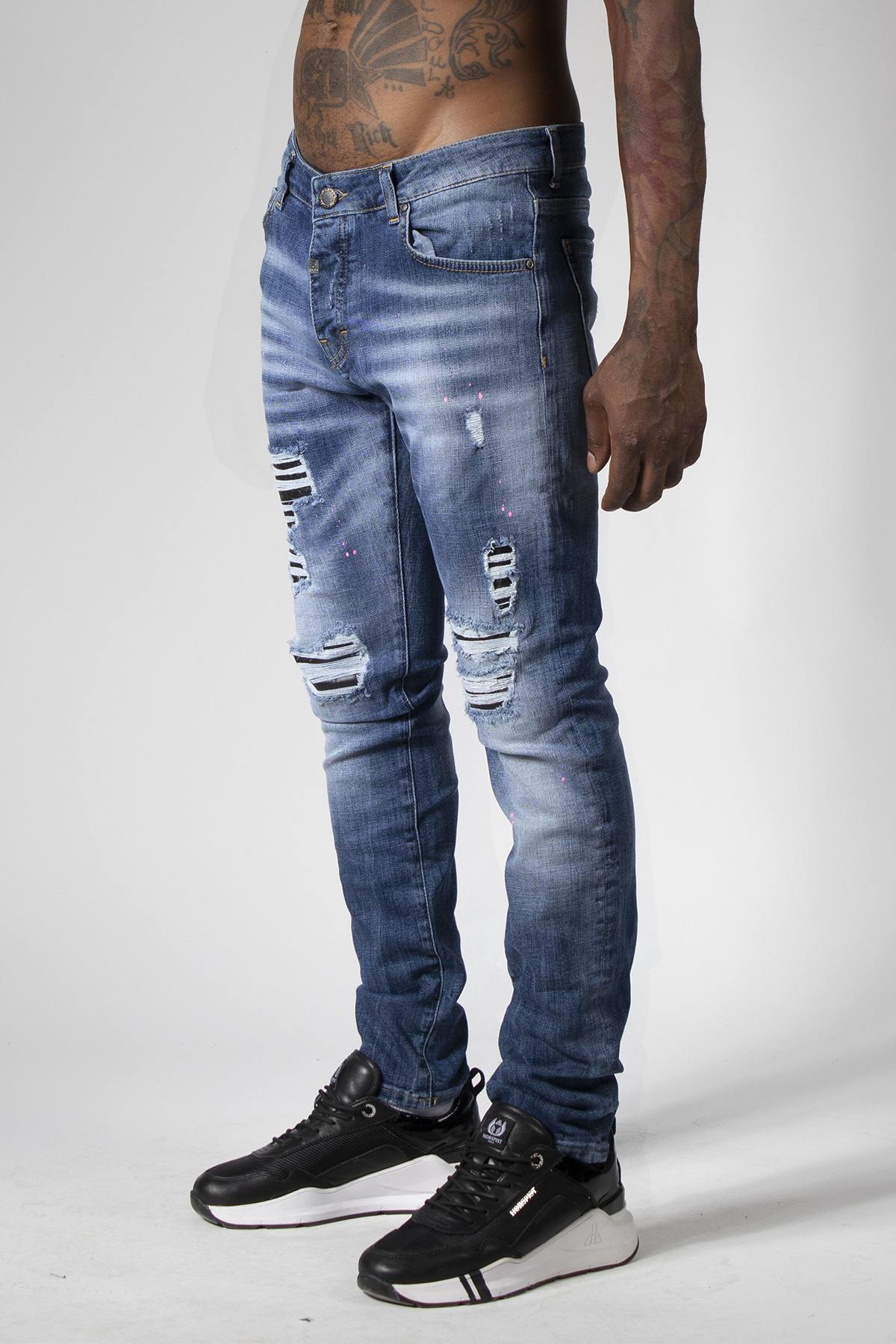 Blue denim jeans with destroyed finish - Image n°10