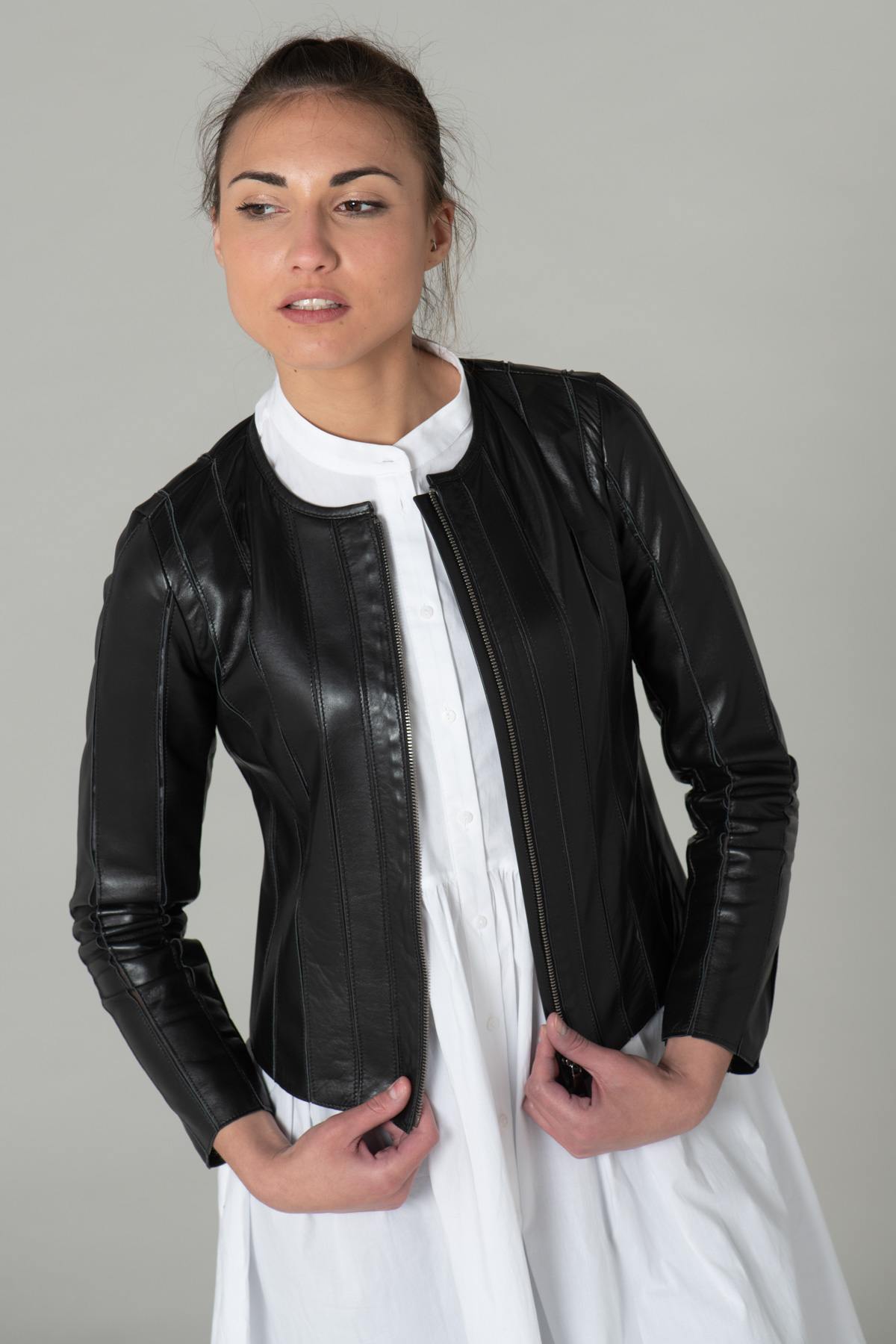 Black lambskin jacket, slim fit, textured ridges, biker-style collar. - Image n°1