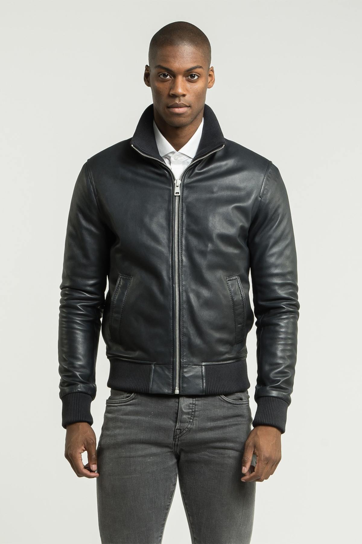 Blue leather jacket with ribbed edges - Image n°1