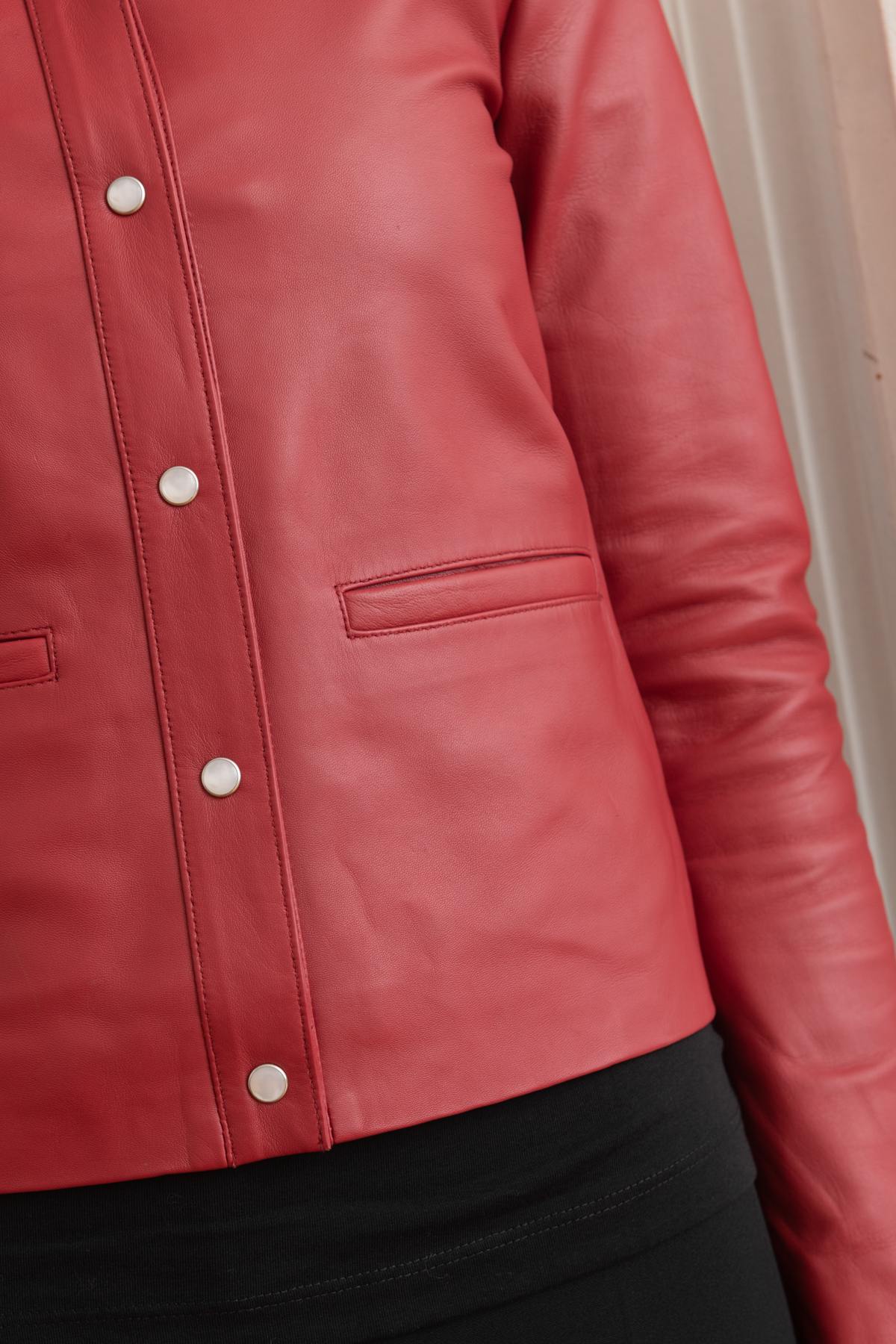 Suppleness defines this red lambskin jacket, cut slim for fit. - Image n°8