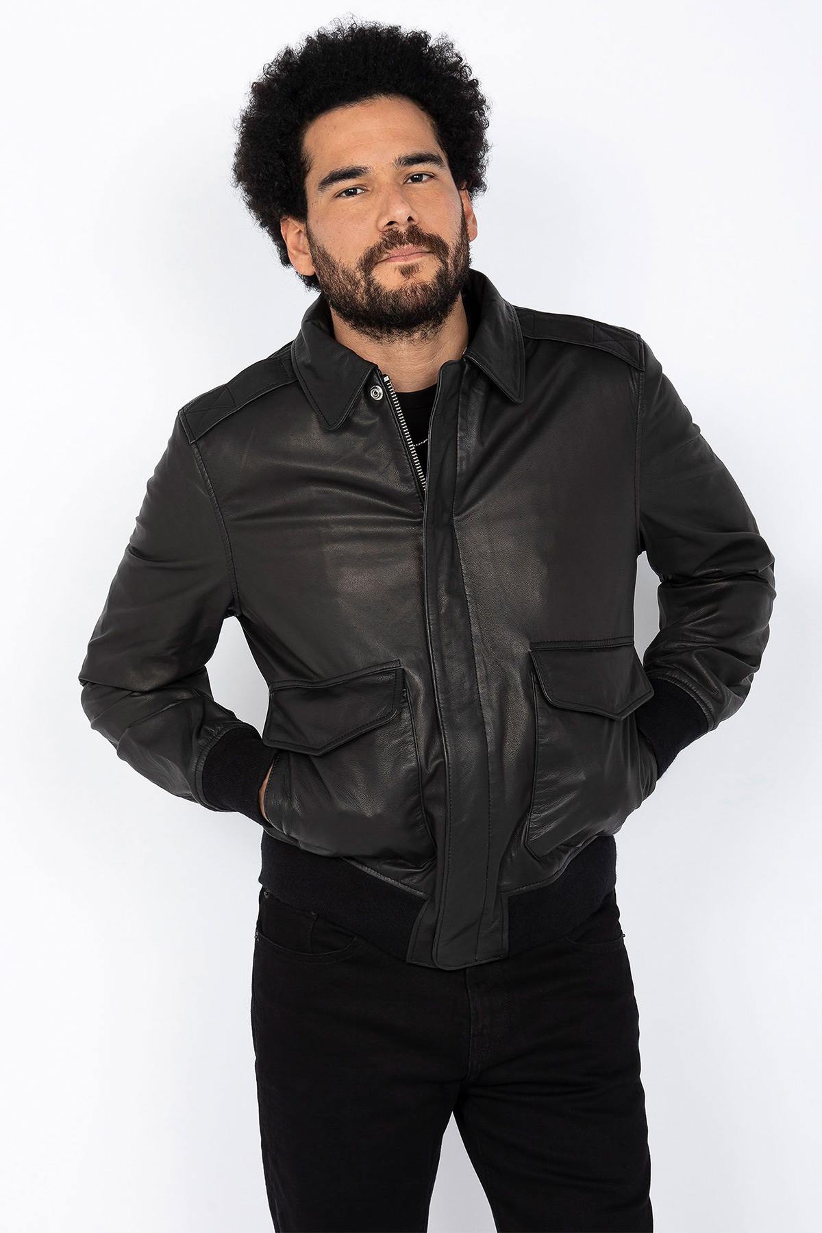 Schott NYC's black goat leather A-2 jacket: a timeless aviator icon. - Image n°1