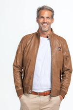 Aged taupe sheep leather jacket-snap pockets, ribbed cuffs, racing flair. - Image n°1