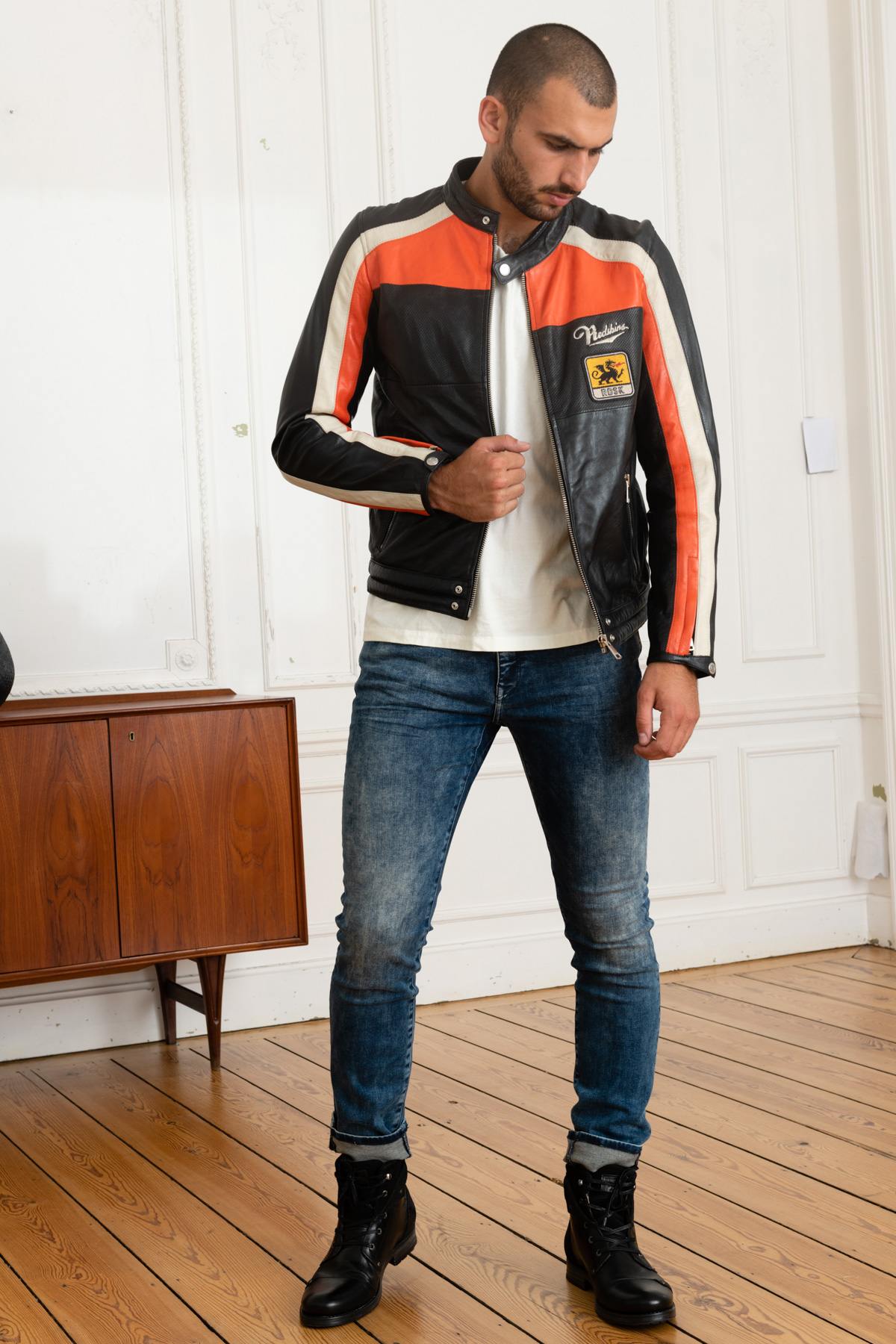Redskins' black sheepskin jacket with bold orange and white stripes. - Image n°2